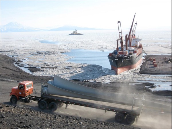 Wind turbine blades transported by truck from McMurdo Station ice pier